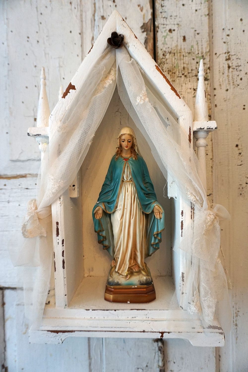 White display shrine including Virgin Mary statue French