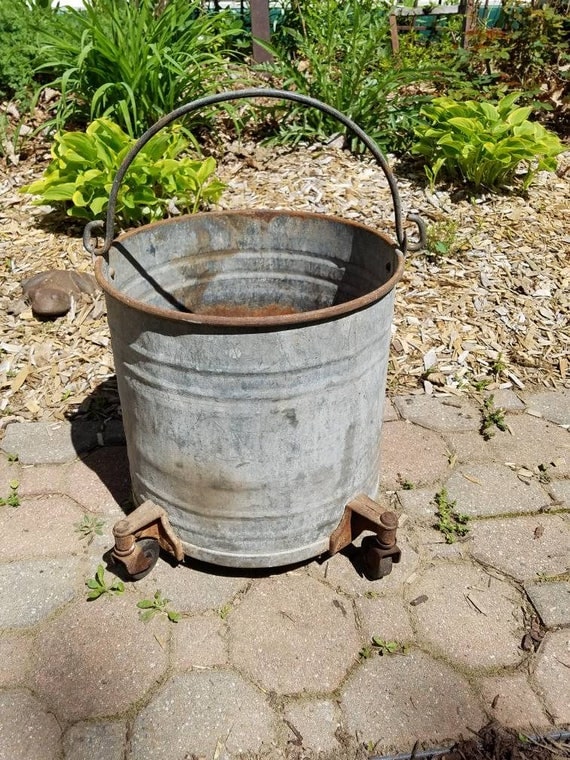 Items similar to Vintage Galvanized Bucket Planter on Wheels Farm