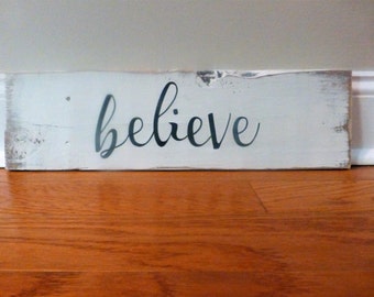 Believe sign, hand painted on weathered, reclaimed wood