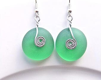 Pale emerald green sea glass dangle earrings, for pierced ears.
