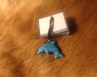 Carved stone dolphin necklace. Made of turquoise.