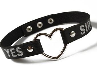 YES SIR custom black bdsm collar with heart decoration and silver glitter personalised text.