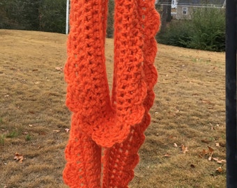 Burnt orange soft wool scalloped-edged scarf.