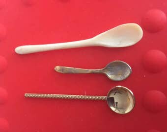 Two brass and one bone salt dip spoons