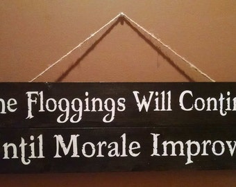 The Floggings Will Continue Until Morale Improves Sign
