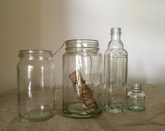 Four glass VINTAGE BOTTLES. Vintage glass apothecary bottles. Great antique / vintage collection