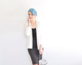 silver rhinestone trimmed white jacket . razzle dazzle Jack Bryan cover up .medium.large .sale