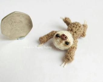 Miniature, baby, sloth, jointed, two toed sloth.