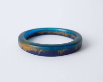 SALE 25% OFF Bracelet Bangle MEDIUM Resin Art, Thin shaped 'Elouera' aquamarine, deep blue and gold pigments, bangle by Clan Collective
