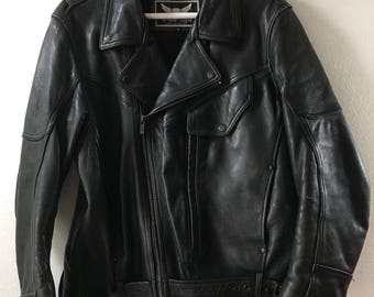 Black leather motorcycle jacket , men size medium .