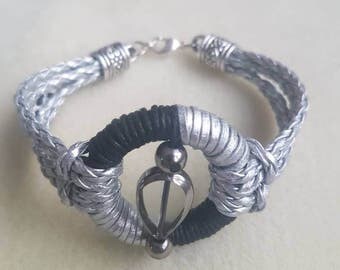 Unique. Handmade bracelet made with strap. Black-silver