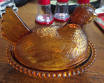 Amber glass hen on nest