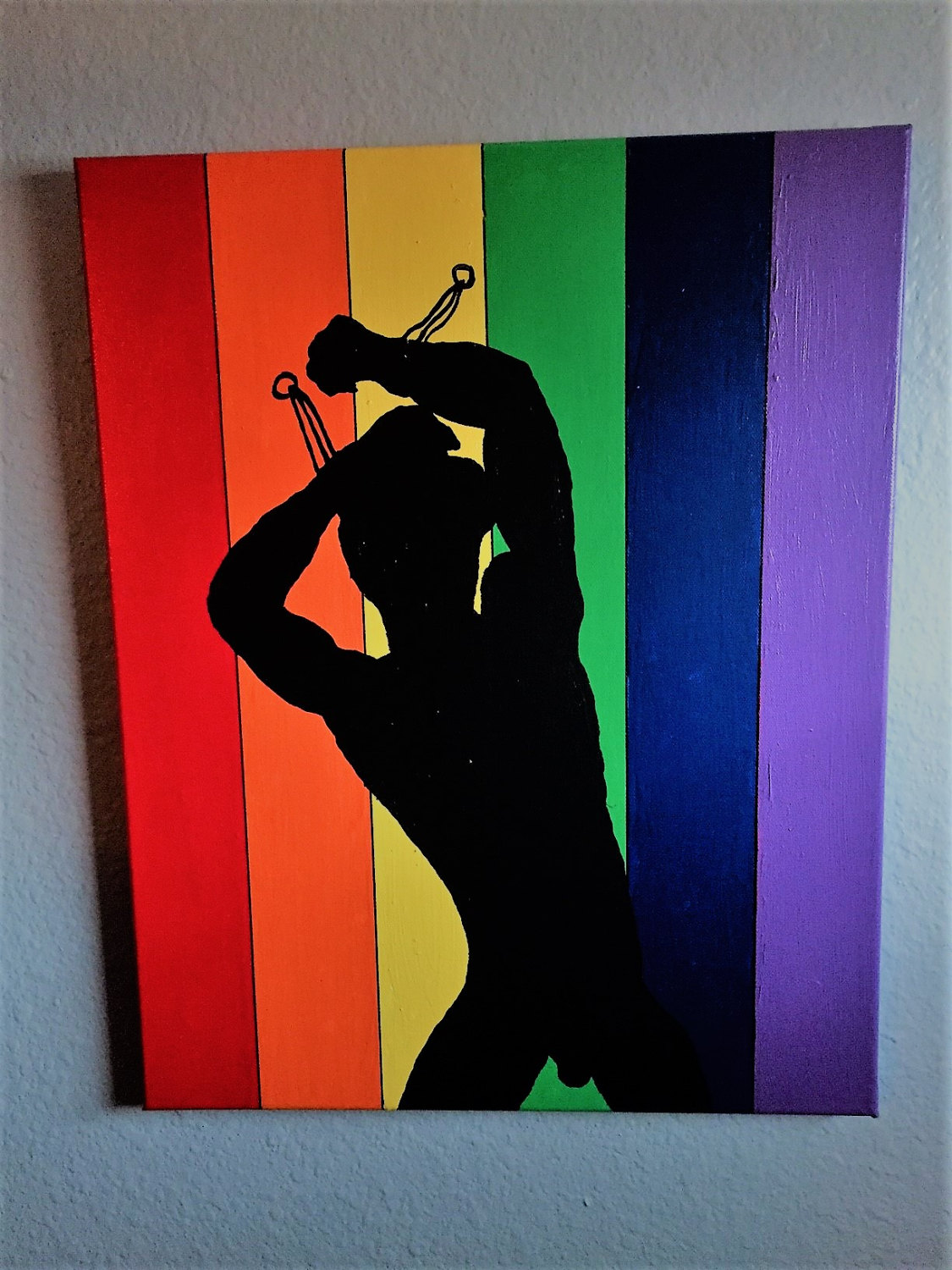 woman paints over gay pride art