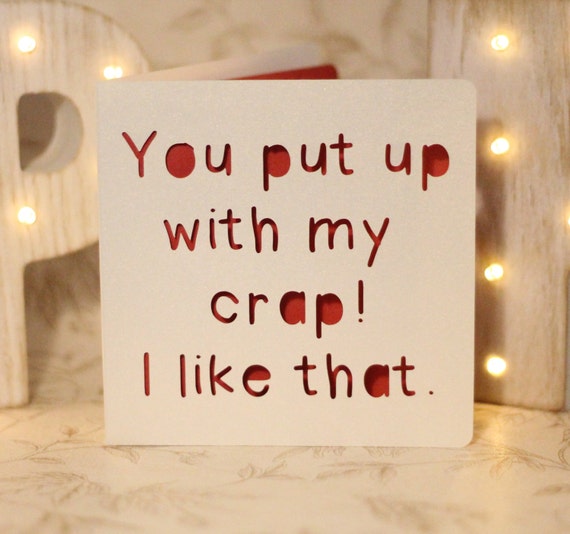 You put up with my crap I like that a paper cut card for the