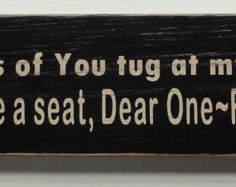 Rustic painted wood sign. "Memories of you tug at my heartstrings..."