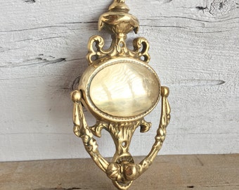 Brass door knocker. Decorative brass door knocker.