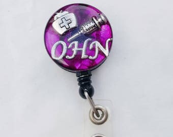 Occupational health nurse name badge holder with nursing cap and syringe detail, purple background