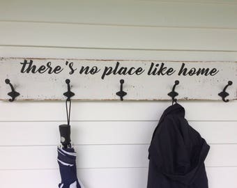 there's place like home coat rack. Heavy duty coat rack made out of barn wood. Measures approx. 39" x 6.5.