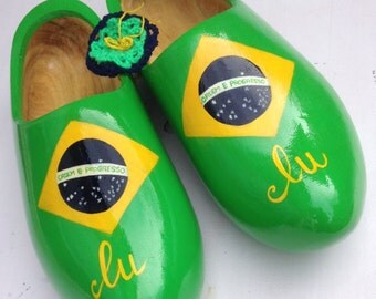 Green clogs with Brazilian flag. Lu's friends have sent a souvenir from Holland, hand-painted clogs on order