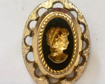 Carved brooch with gold highlights would look great on a choker