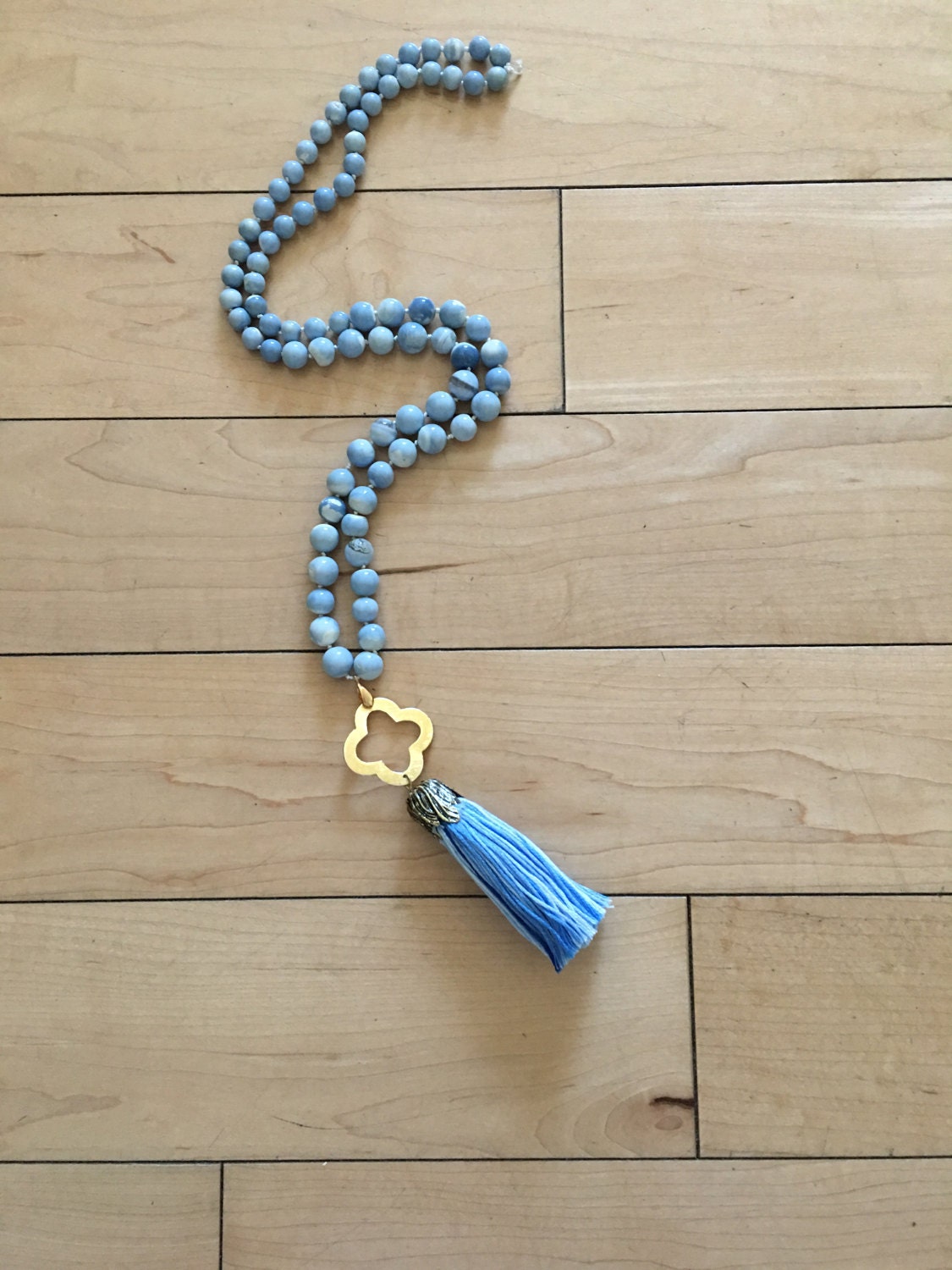 Hand Knotted Gorgeous Blue and White Glass Beads with Gold Clover Pendant and Blue and White Silk Tassel