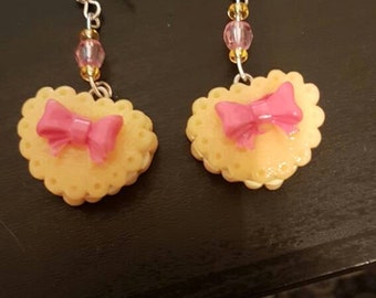 Pink and yellow bow love heart cake earrings