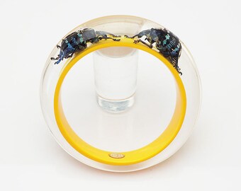 Yellow lucite bangle with real beetles