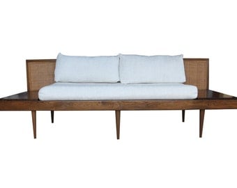 Mid century platform sofa with attached floating end tables