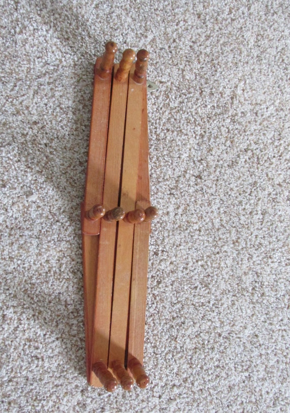 Accordion Wood Peg Rack in Natural Wood Color