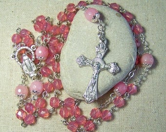 Catholic rosary with opal pink faceted glass beads in silver