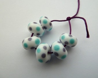 handmade lampwork glass beads, blue and purple spotty beads