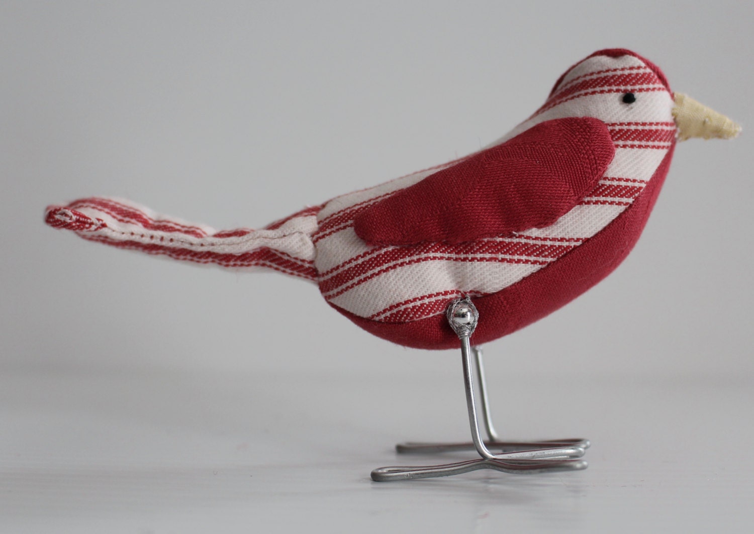 Red and red stripes fabric bird with quilted tail bird