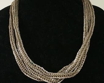 Extra long, heavy, textured silver toned chain necklace.
