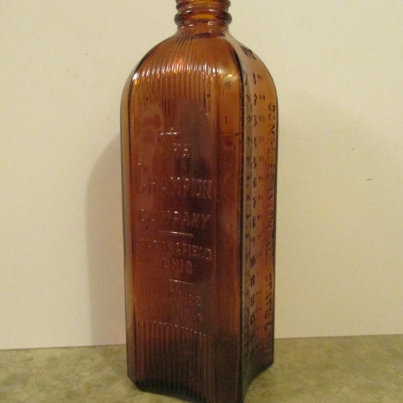 1940s Champion Company Embossed Brown Glass Embalming Fluid