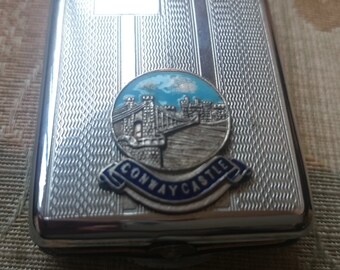 vintage chrome plated matchbook holder engine turned with crest of Conway Castle