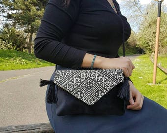 black embroidered clutch bag