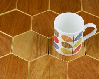 Set of four hexagonal drinks coasters, handmade from reclaimed plywood. Honeycomb design, natural, wooden kitchenware, house-warming gift