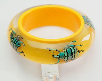 Funky bright yellow bangle bracelet with real exotic beetles