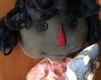 Raggedy annie with her cat