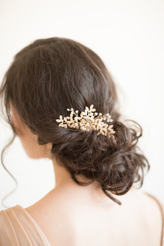 Gold Bridal Comb, Wedding Hair Comb, Gold Wedding Headpiece, Pearl Wedding Comb, Gold Leaf Bridal Comb Gold Bridal Comb, Wedding Hair Comb, Gold Wedding Headpiece, Pearl Wedding Comb, Gold Leaf Bridal Comb Gold Bridal Comb, Wedding Hair Comb, Gold Wedding Headpiece, Pearl Wedding Comb, Gold Leaf Bridal Comb Gold Bridal Comb, Wedding Hair Comb, Gold Wedding Headpiece, Pearl Wedding Comb, Gold Leaf Bridal Comb Gold Bridal Comb, Wedding Hair Comb, Gold Wedding Headpiece, Pearl Wedding Comb, Gold Leaf Bridal Comb 🔎zoom Item details 5 out of 5 stars. (3,434) reviews Shipping & Policies Gold Bridal Comb This wedding hair comb is embellished with hand wired pretty leaves that sparkle with tiny rhinestones, freshwater pearls and crystals. The brass flower is hand painted with a pearl enamel but can be kept as a bright gold brass color by request. Please note that these are handmade items and can vary slightly in appearance from piece to piece. ♥ SIZE: Approximately 4 1/2