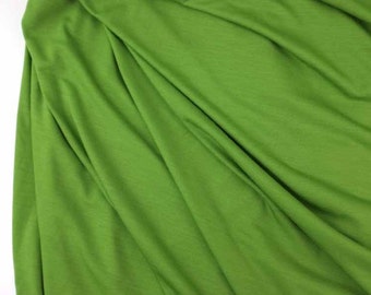 Lightweight wool and lycra jersey fabric in lily green, sewing fabric, by the yard.
