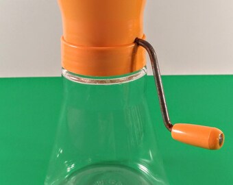 Vintage Androck Nut Chopper. Clear Glass Base with Peach/Orange Plastic Top & Silver Tone Crank Handle. Retro, Mid Century Modern Kitchen.