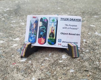 Recycled skateboard business card holder