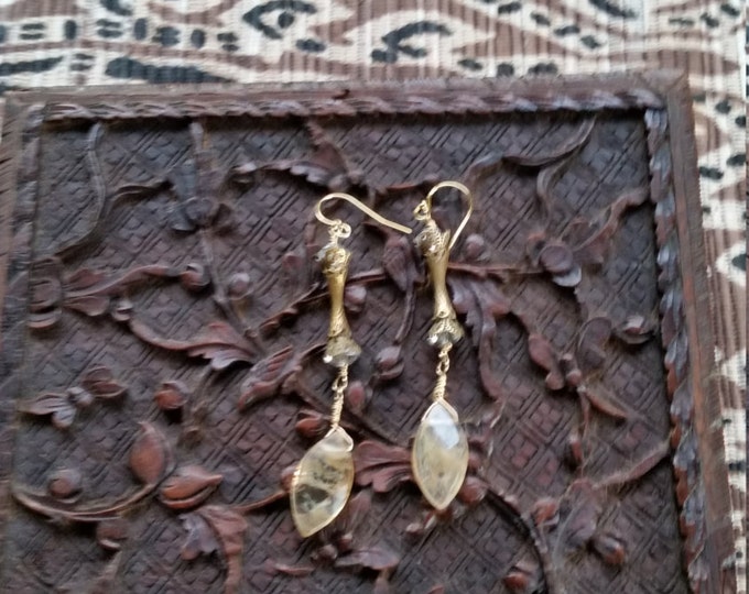 Besautiful and Very Unusual Brass Pieces in these Earrings. The Bottom Dangle is a Large Gold Rutilated Quartz Briolette