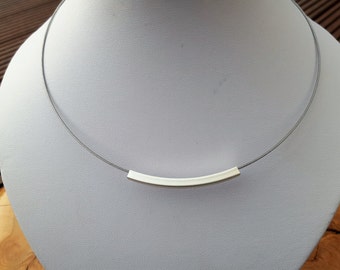 Necklace with metal tube