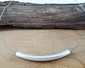 Necklace with metal tube