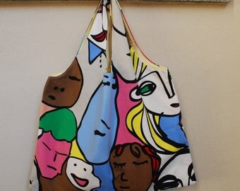 Reversible shoulder bag with funny faces