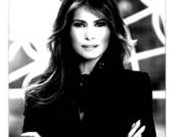 Free FLOTUS - Melania Trump White Next Level T-shirt - Quantity Discounts down to Six Bucks each