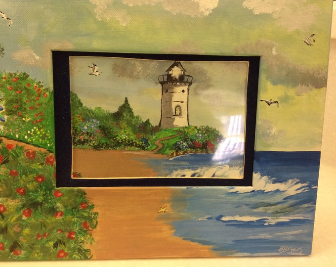 Lighthouse frame with easel back.