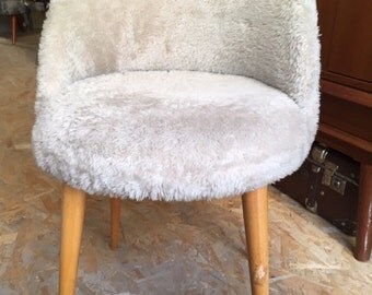 small armchair in light gray hair feet compass